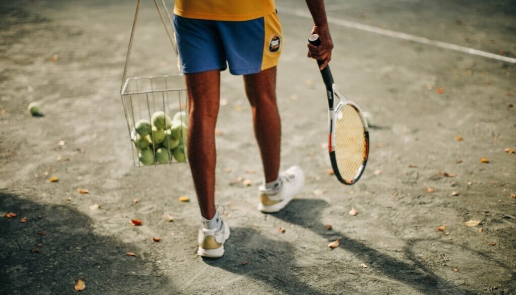 person-holding-tennis-racket-4371608_1